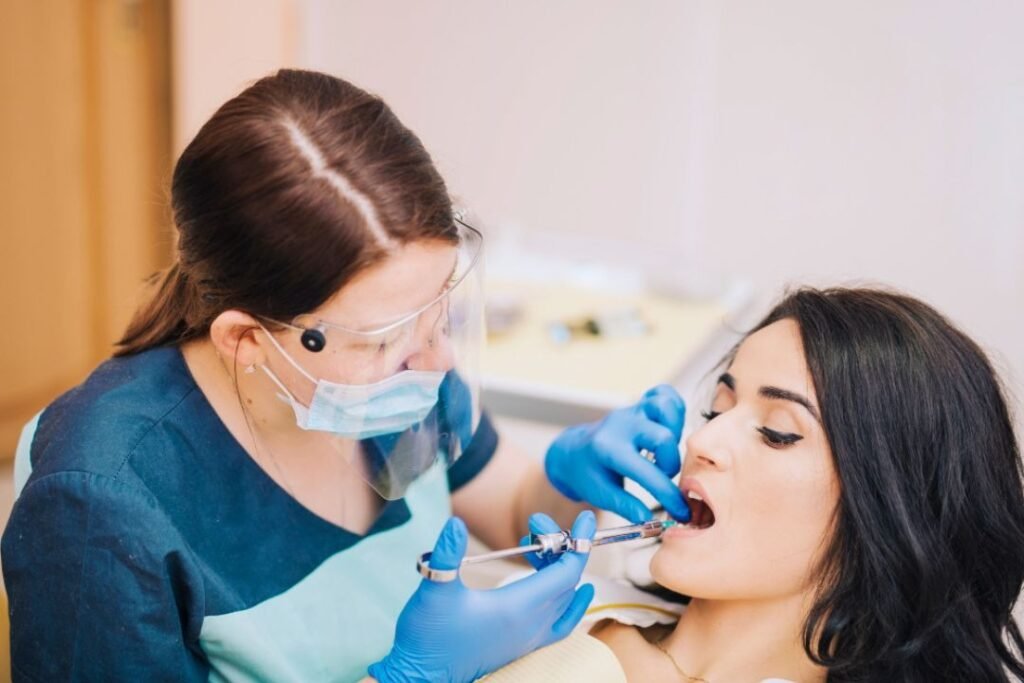 Dentist explaining dental implant cost and treatment plan to patient in Bangalore