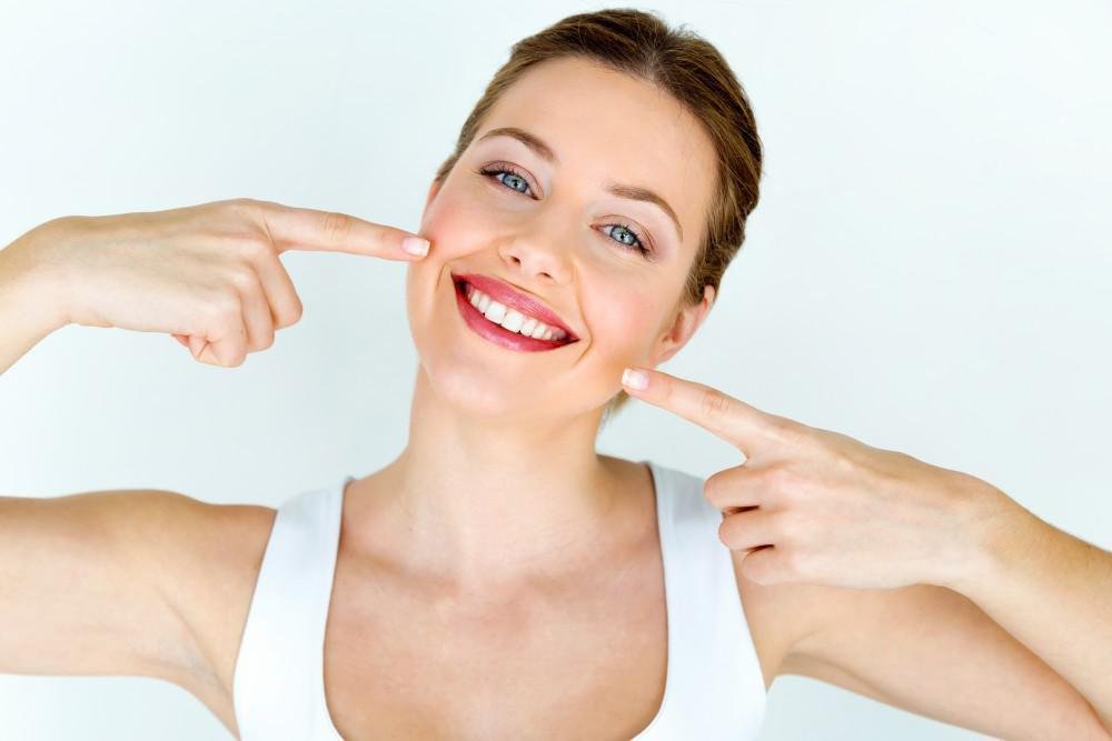 Patient smiling after painless dentistry treatment at Archak Dental Clinic Bengaluru